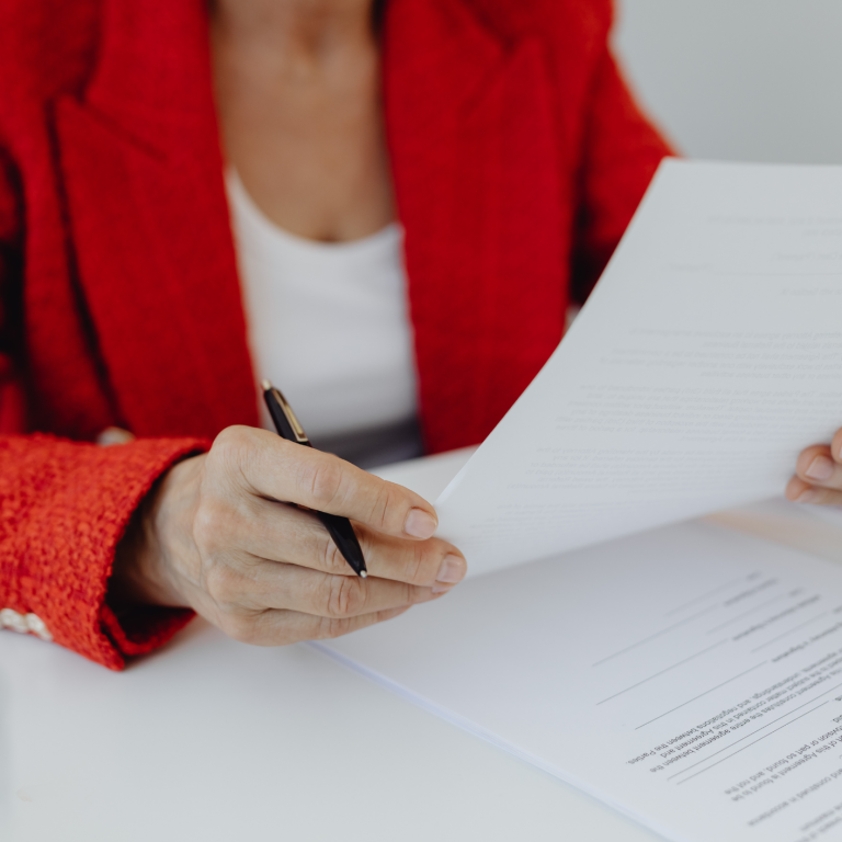 women reviewing documents at QMO